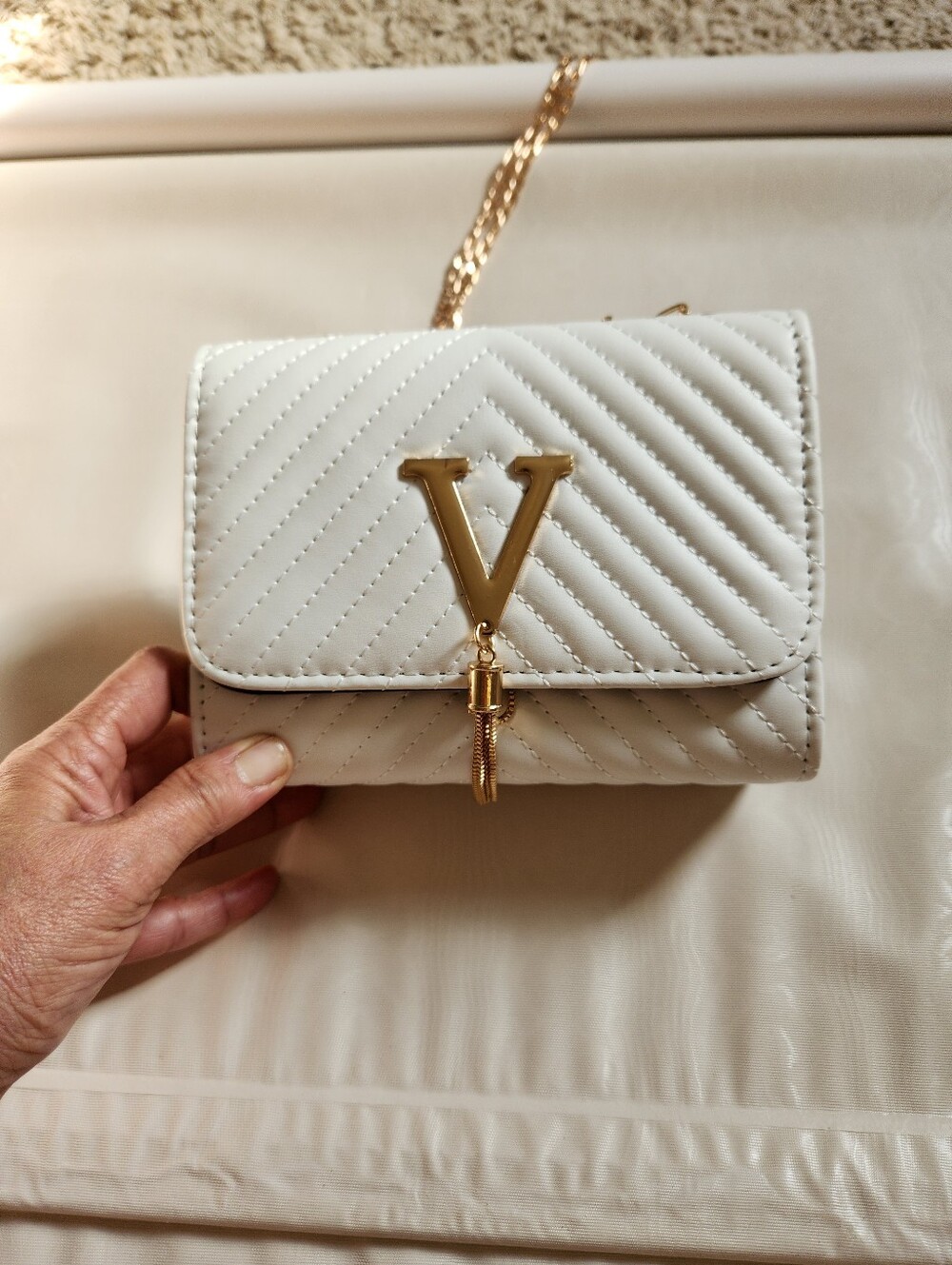 Quilted White Crossbody Bag with Gold V Accent